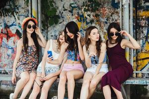 Five beautiful young girls relaxing photo