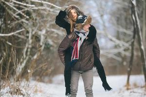 man carries a girl on his back photo