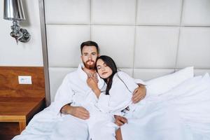 Picture showing happy couple resting in hotel room photo