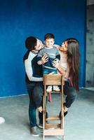 young family having fun at home photo