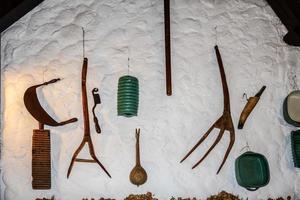 Budapest, Hungary, 2014. Old farming tools on a wall in Budapest photo