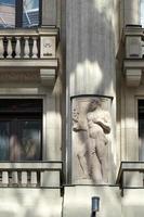 Budapest, Hungary, 2014. Statue of a male figure on an apartment block in Budapest photo