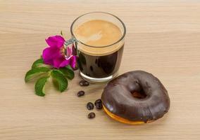 Chocolate donuts on wooden background photo