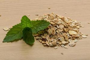 Oats on wooden background photo