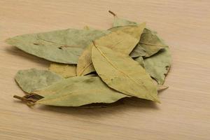 Laurel on wooden background photo