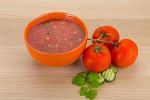 Gaspacho in a bowl on wooden background photo