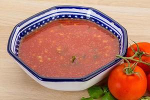 Gaspacho in a bowl on wooden background photo