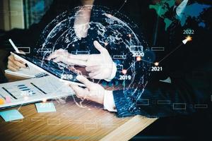 Businessman and business woman discuss to working with using tablet and for searching information stock market chart for trading to Make a profit. Planning and Investment concept. photo
