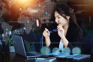 Investment concepts, businesswomen use computers to analyze stock markets, quantitative data collection, financial statement analysis, profitability through internet technology. photo