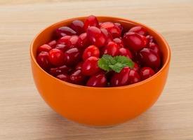 Cornus in a bowl on wooden background photo