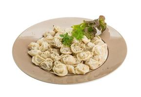 Russian dumplings on the plate and white background photo