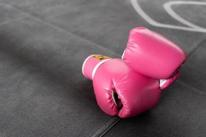 pink boxing gloves for girl and woman fight with copy space. photo