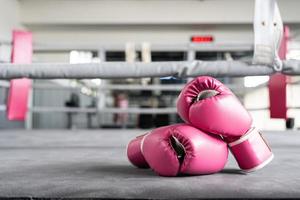 pink boxing gloves for girl and woman fight with copy space. photo