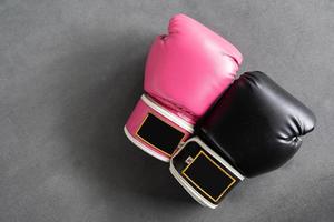 pink and black Boxing glove in punching in woman concept. photo