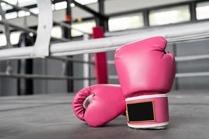 pink boxing gloves for girl and woman fight with copy space. photo