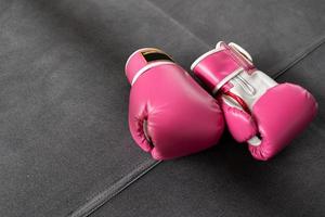 pink boxing gloves for girl and woman fight with copy space. photo
