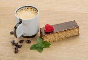 Coffee with cake on wooden background photo