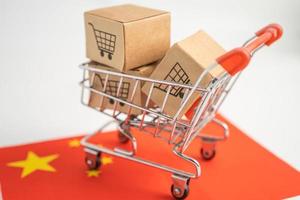 Box with shopping cart logo and China flag, Import Export Shopping online or eCommerce finance delivery service store product shipping, trade, supplier concept. photo