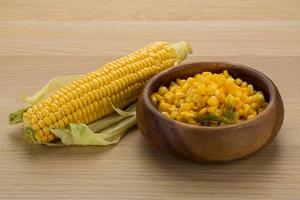 Sweet corn in a bowl on wooden background photo