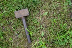 a sledgehammer is lying alone, a construction tool. minimalism photo