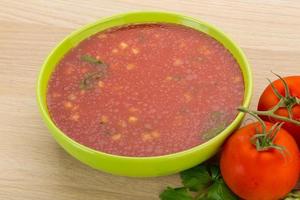 Gaspacho in a bowl on wooden background photo