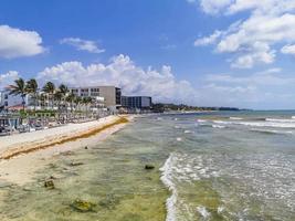 Tropical mexican beach full of people Playa del Carmen Mexico. photo