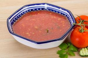 Gaspacho in a bowl on wooden background photo