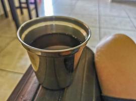 Glass or cup pot with hot ginger tea. photo