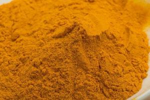 Curcuma powder close up view photo