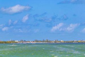 Panorama landscape view Holbox island turquoise water and ferry Mexico. photo