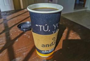 Playa del Carmen Quintana Roo Mexico 2021 Coffee to go cup of black coffee on wooden background. photo