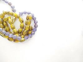Round beads like marbles are often used for worship or after Muslim prayers, rosary beads isolated on white background.