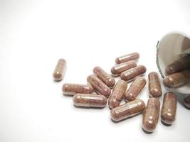 medicine capsules and bottles isolated on a white background photo