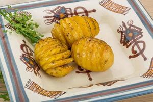 Baked potato on the plate close up view photo