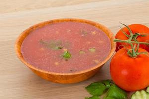 Gaspacho in a bowl on wooden background photo