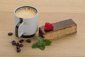 Coffee with cake on wooden background photo