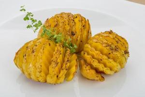 Baked potato on the plate photo