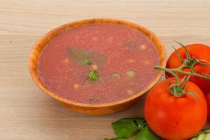 Gaspacho in a bowl on wooden background photo