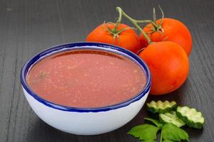 Gaspacho in a bowl on wooden background photo