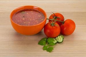 Gaspacho in a bowl on wooden background photo