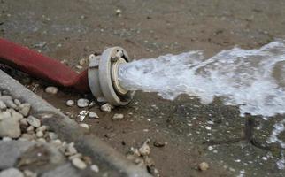 Extreme weather - water being pumped out of a flooded basement in Cologne, Germany, after heavy rain falls. photo