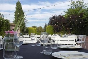 Outdoor venue with dinner tables before event photo