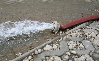 Extreme weather - water being pumped out of a flooded basement in Cologne, Germany, after heavy rain falls. photo