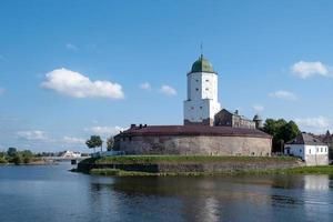 Vyborg, Leningrad region, Russia. - August 27, 2022. Medieval knight's castle from the Vyborg city embankment. photo