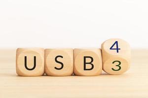 USB 3 to USB 4 change concept. Flip Wooden blocks with text. Copy space photo