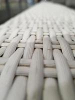 Close up photo of white artificial rattan wicker.