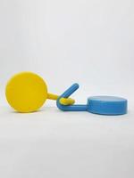 Two round blue and yellow clothes hook hangers that go hand in hand. photo