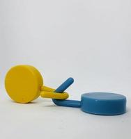 Two round blue and yellow clothes hook hangers that go hand in hand. photo