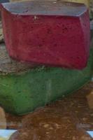 Assorted gourmet french cheese. Red and green color photo