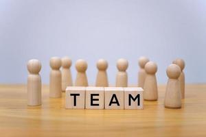 The view of businessmen they work together. and teamwork concept. Wooden puppets and the word team photo